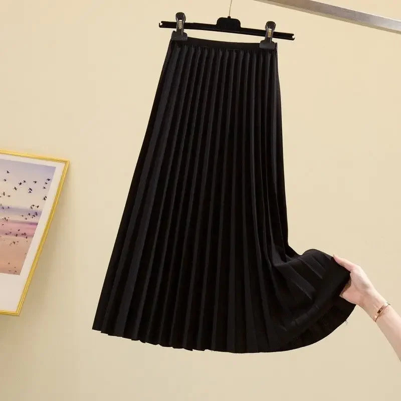 Jupe évasée taille haute, plissée.